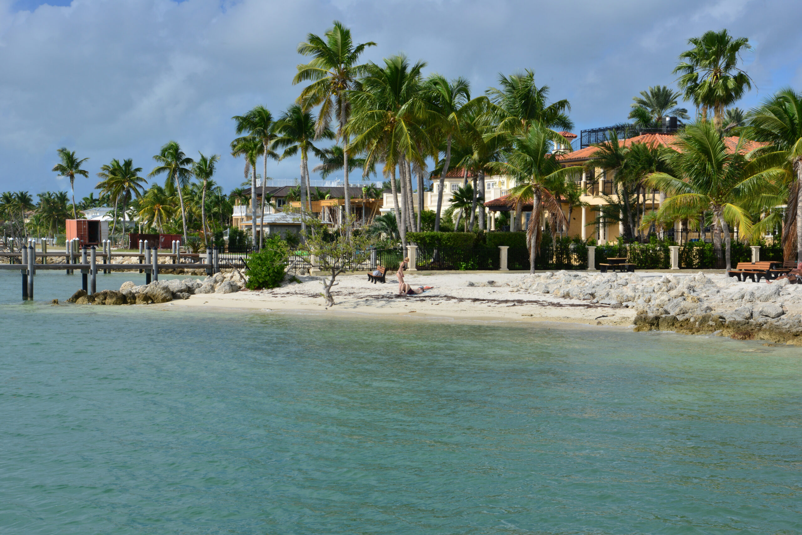Turquoise water, palm trees, beachfront villas