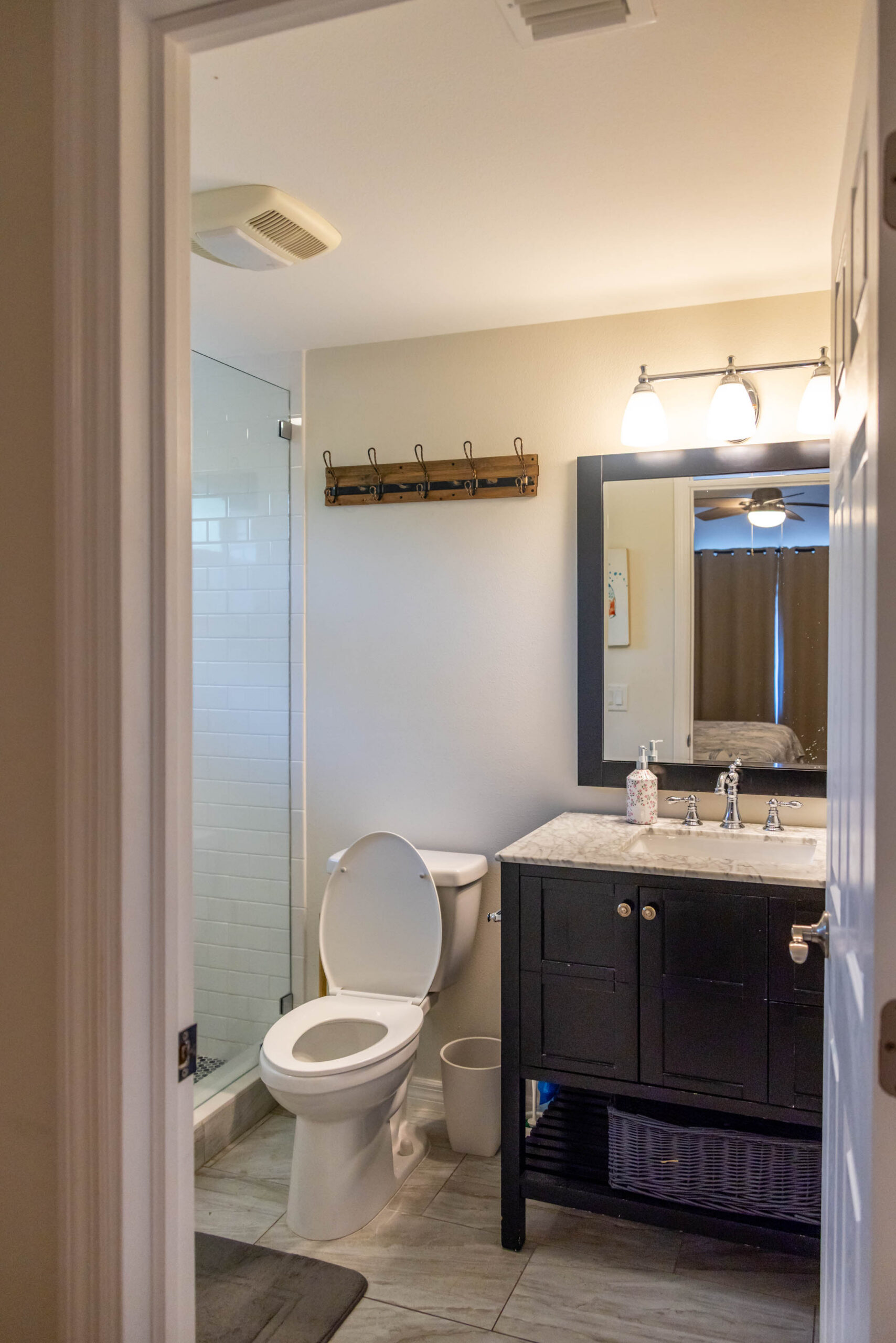 Small bathroom with glass shower and vanity