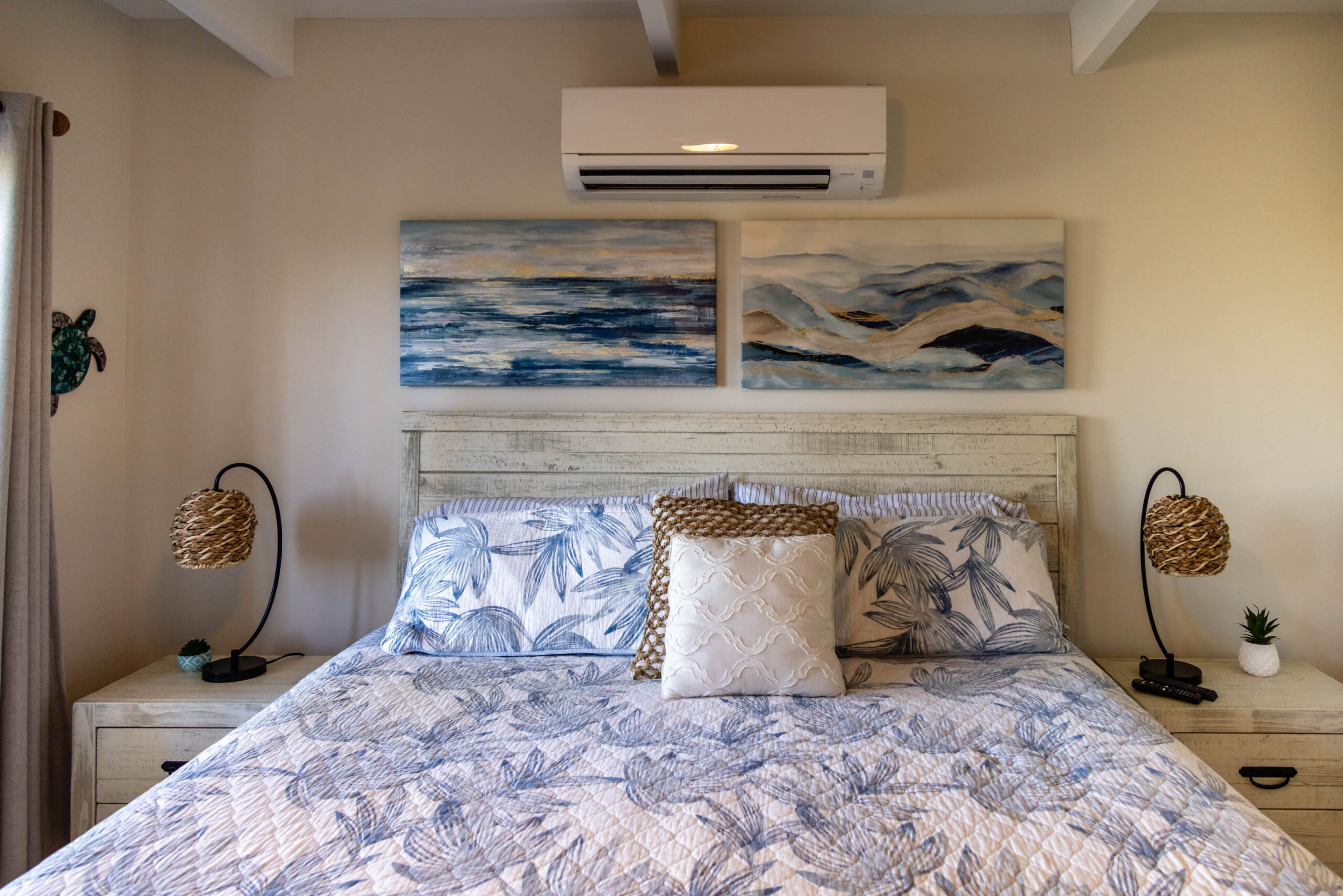 Cozy bedroom with patterned bedding and wall art