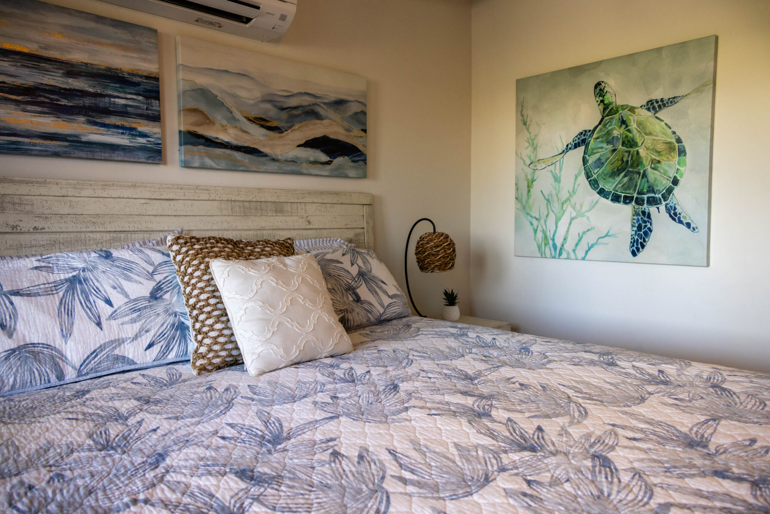 Coastal bedroom with sea turtle wall art