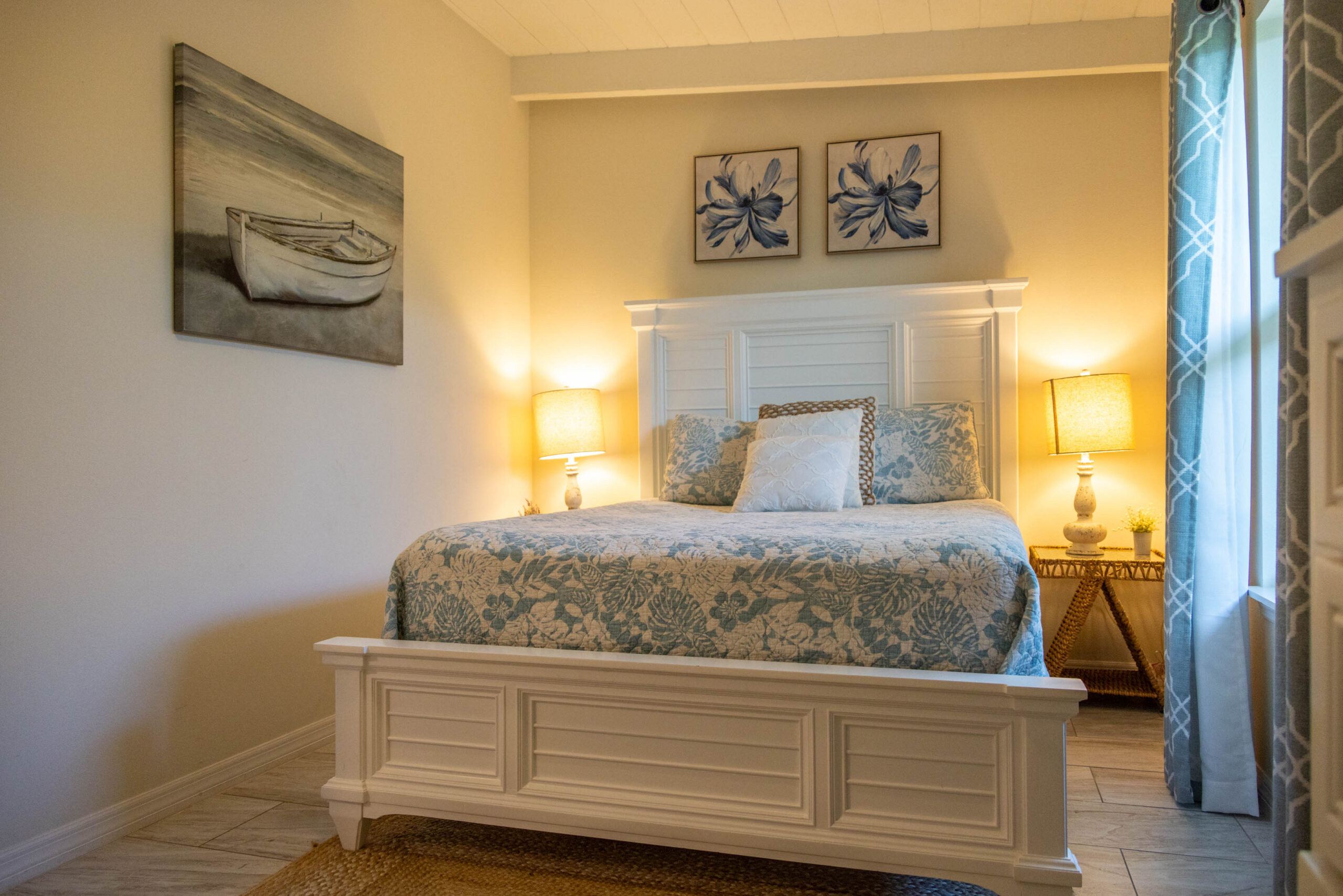 Cozy bedroom with white bed and floral bedding