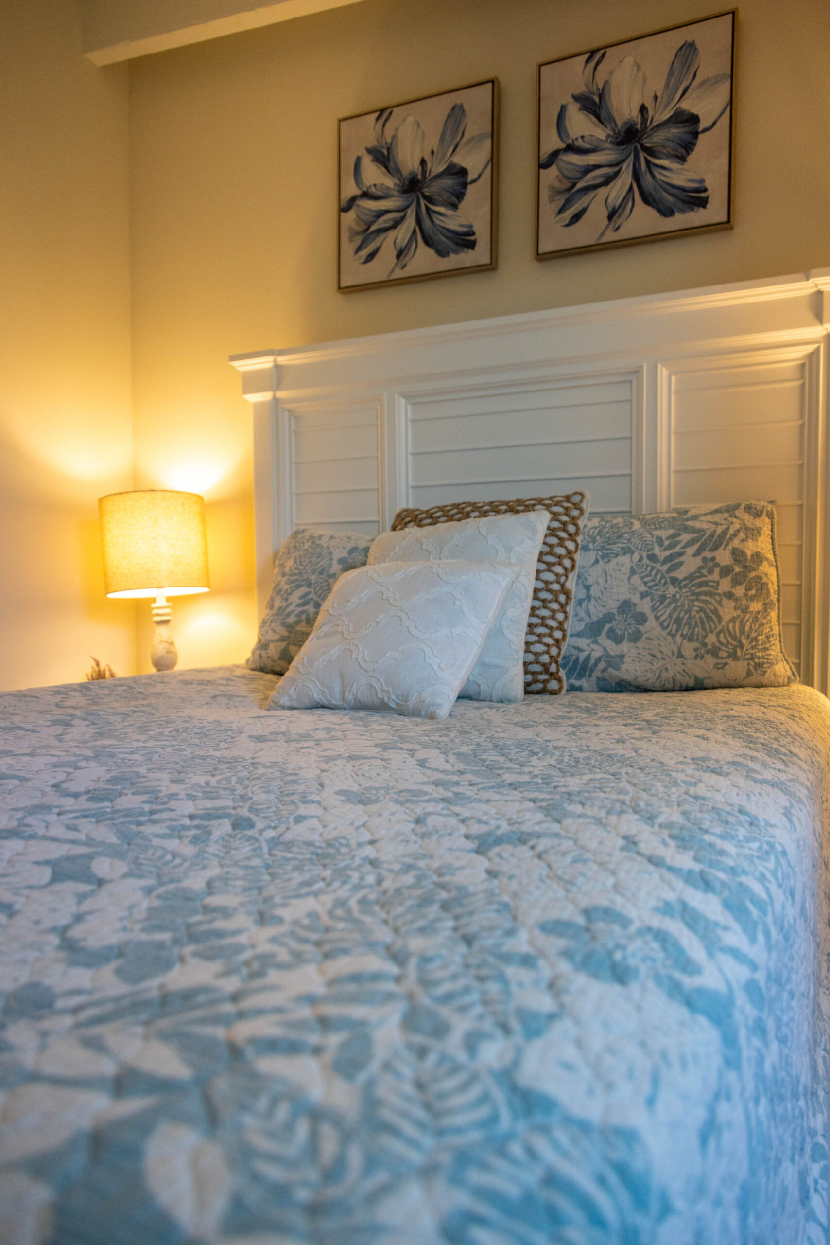 Cozy bedroom with blue floral quilt