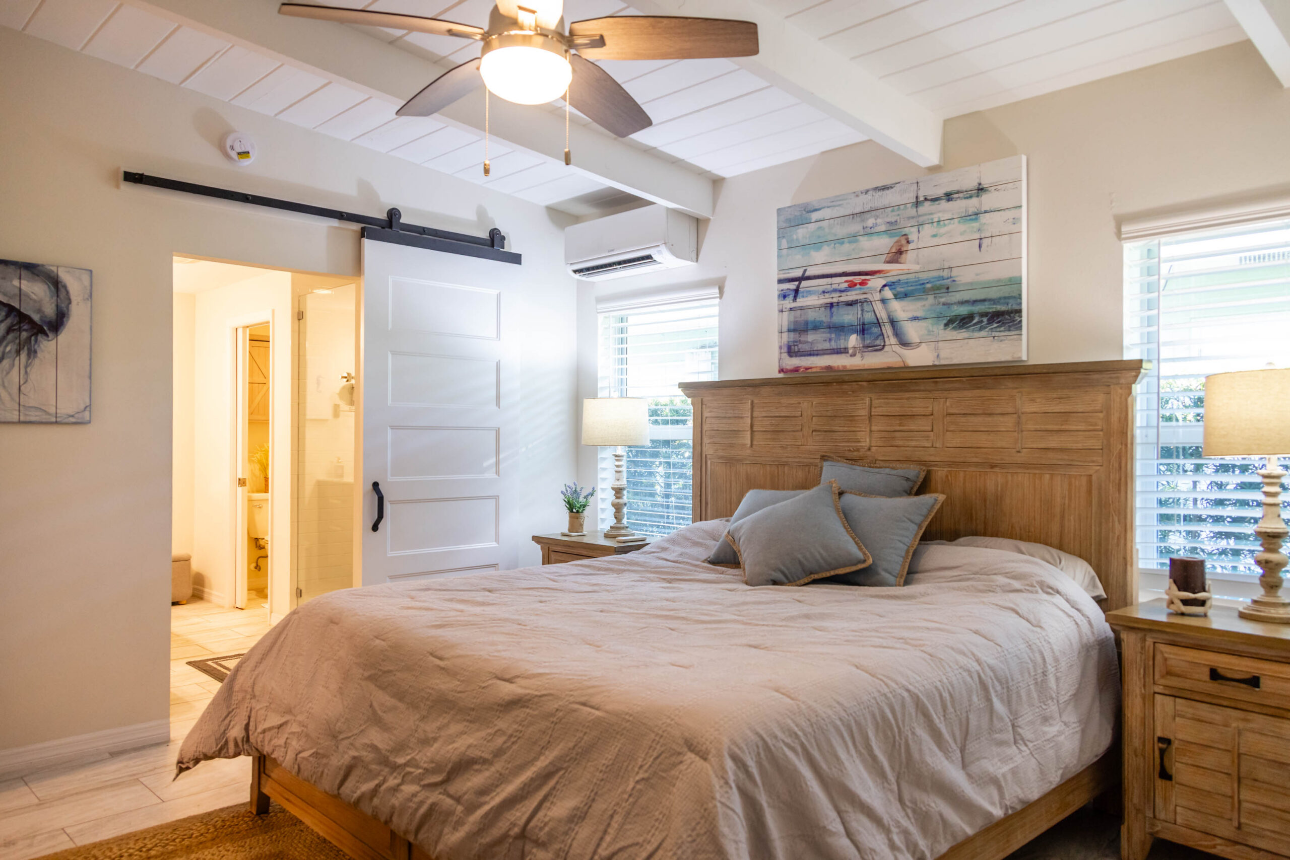 Cozy bedroom with wooden bed and barn door