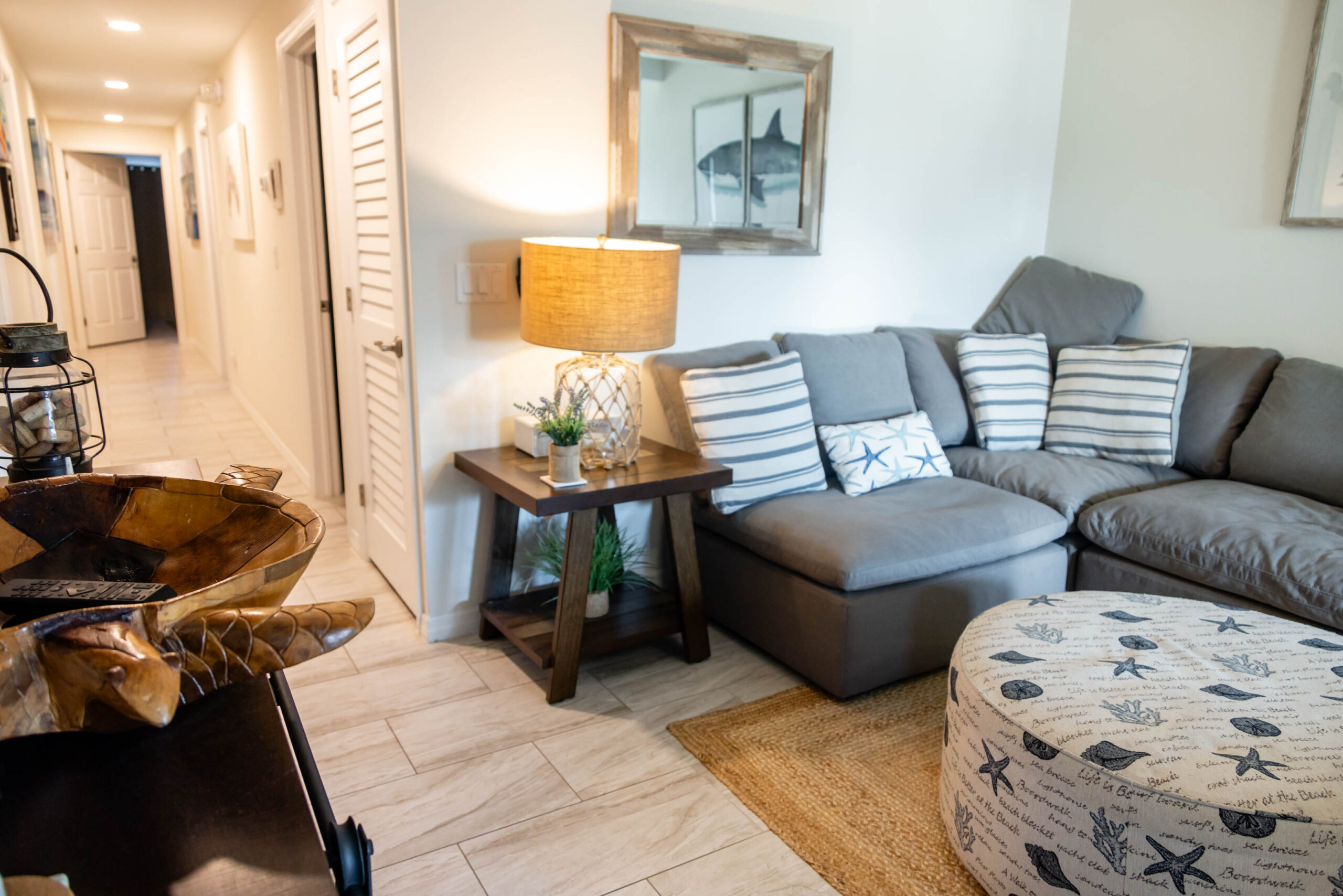 Cozy living room with gray sectional and ottoman