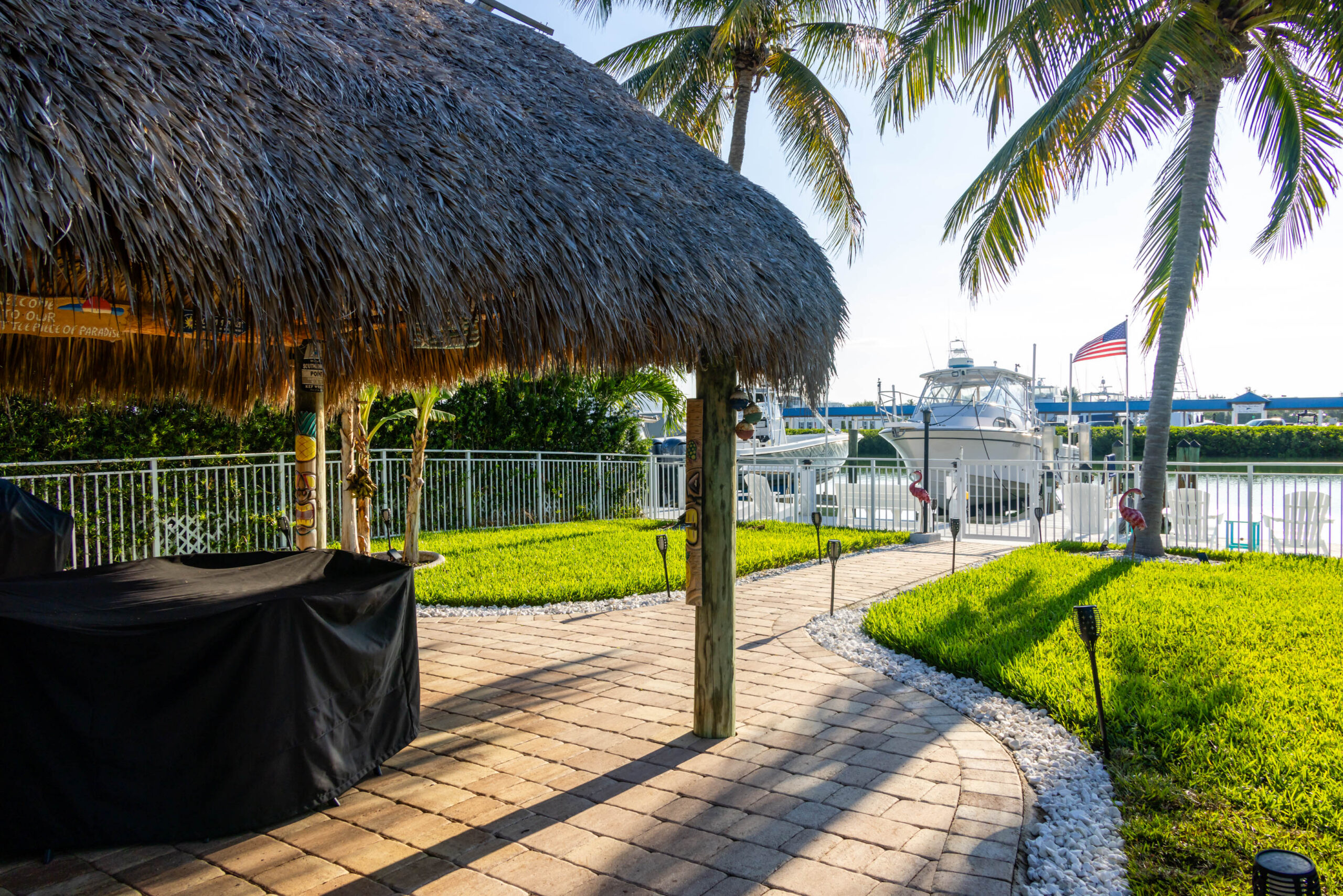 Waterfront palapa patio with docked boats