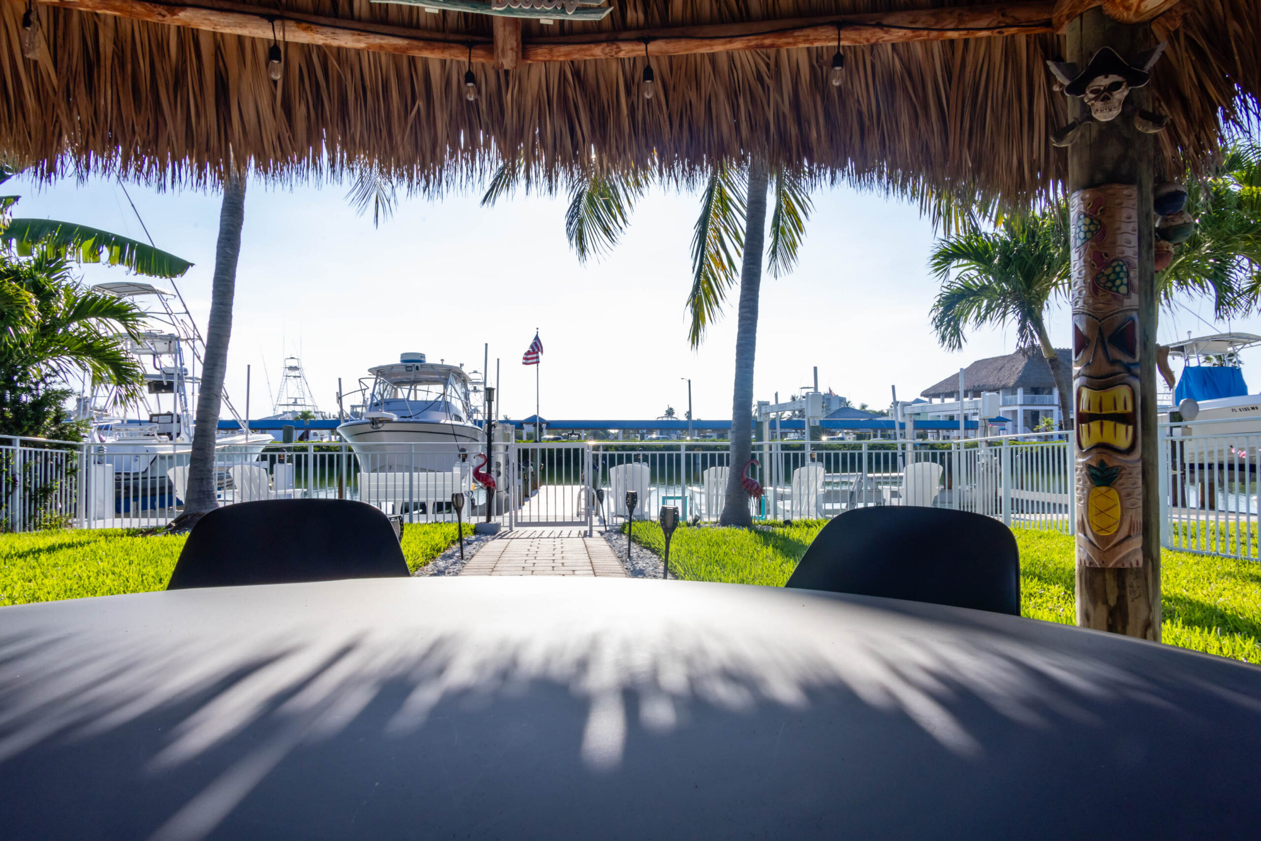 Marina view from shaded tiki hut table