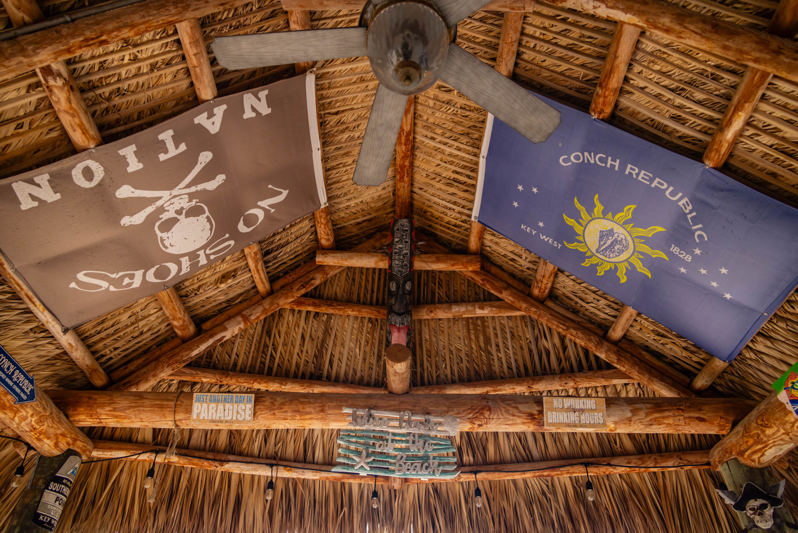 Thatched tiki hut ceiling with flags