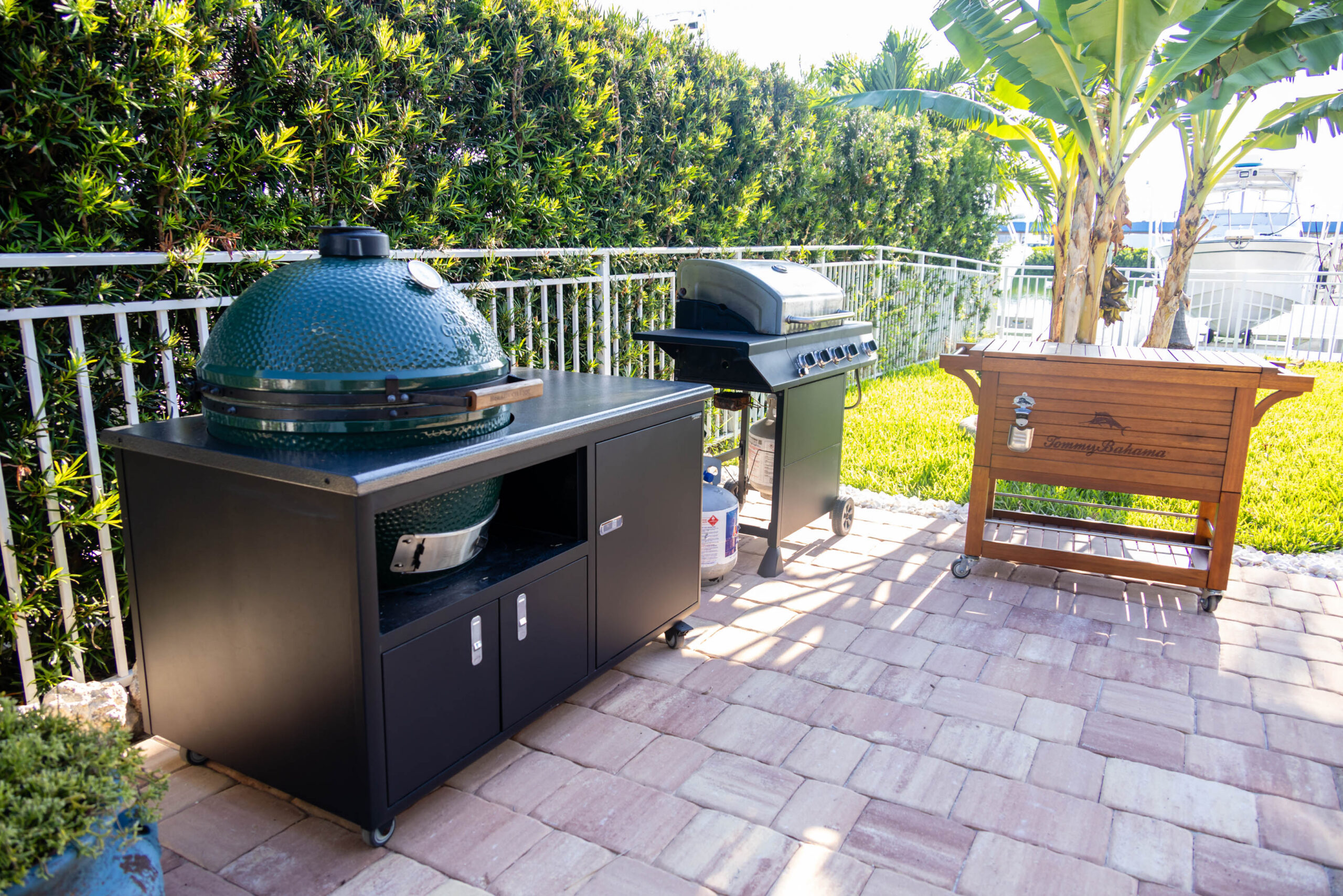 Patio featuring ceramic kamado and gas grills