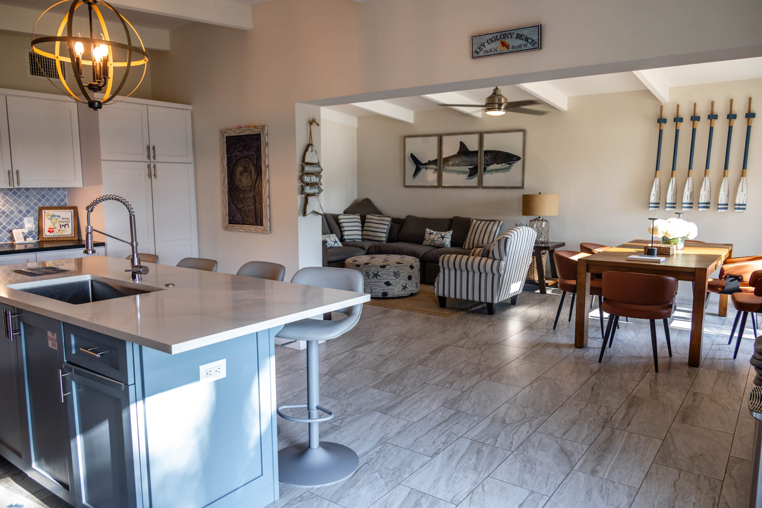Coastal open kitchen with island and oars