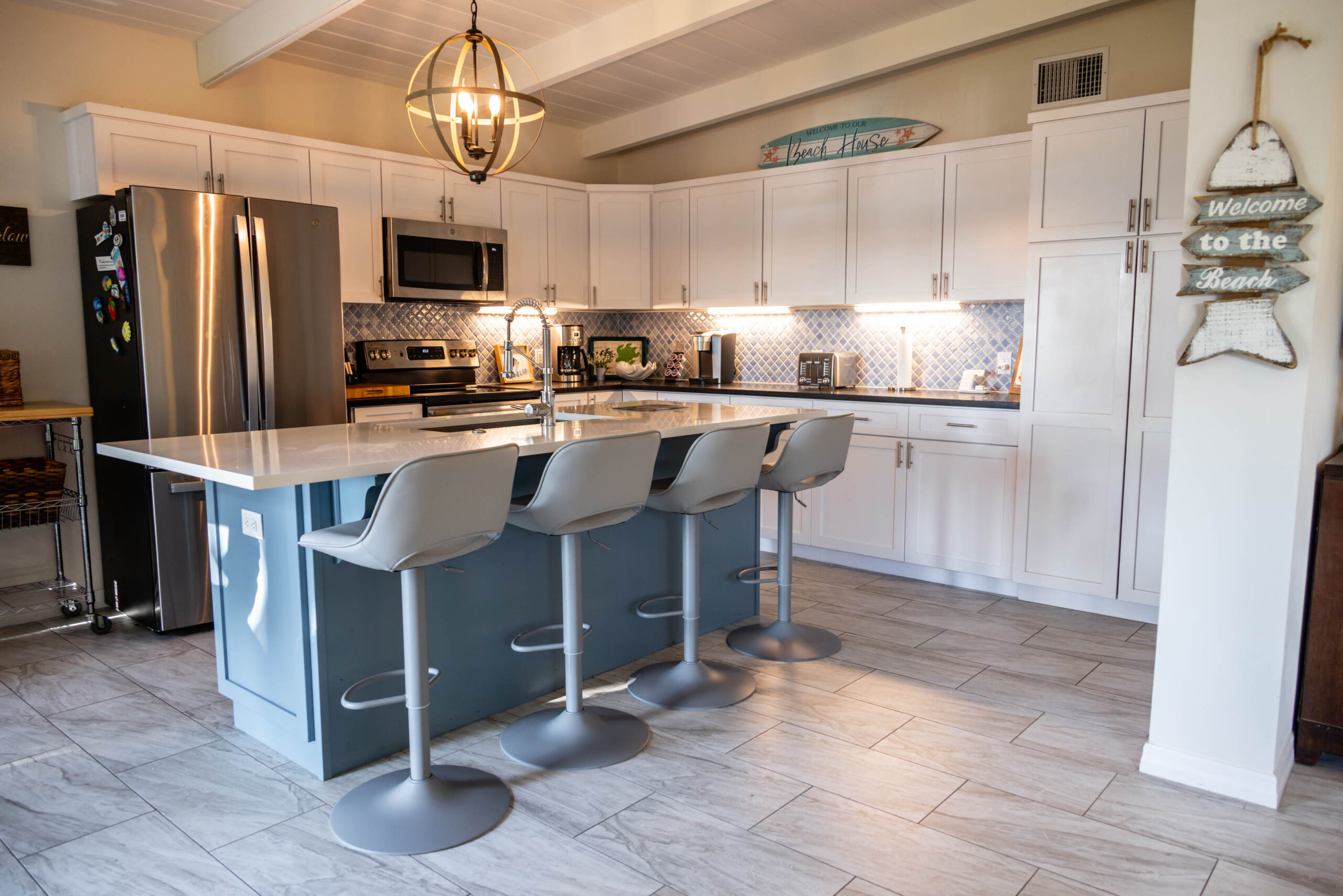 Modern kitchen island with three bar stools