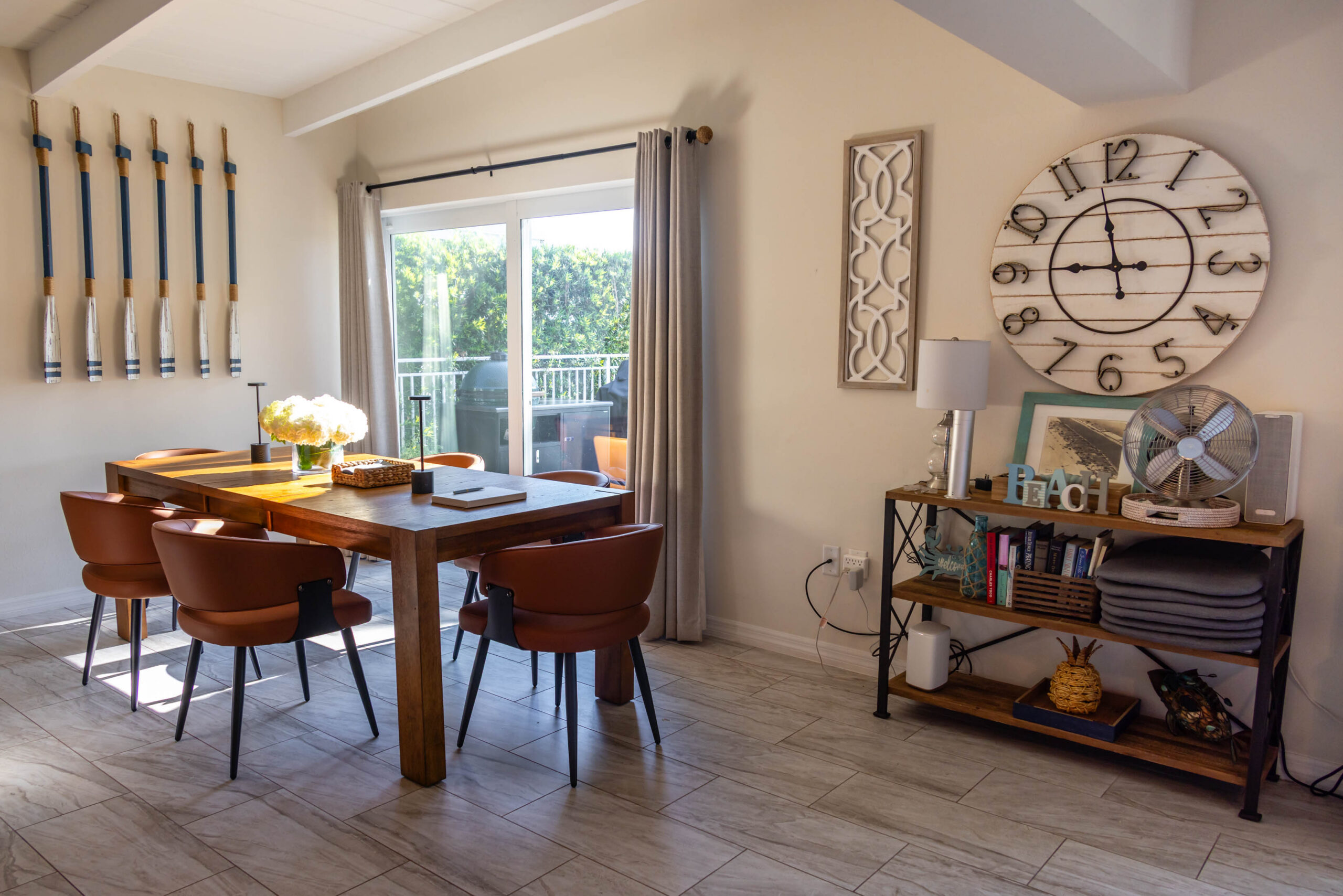 Sunlit dining room with wooden table and chairs