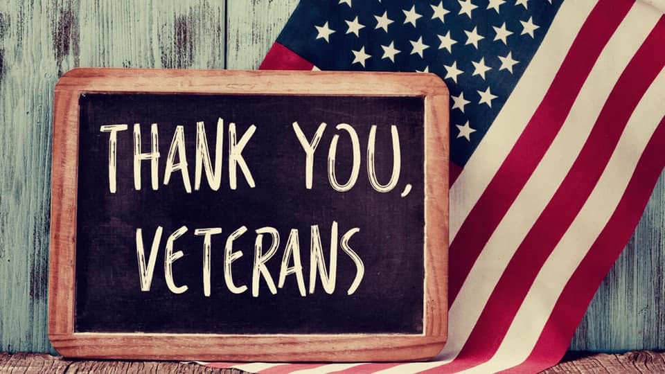 Chalkboard reading Thank You Veterans with American flag