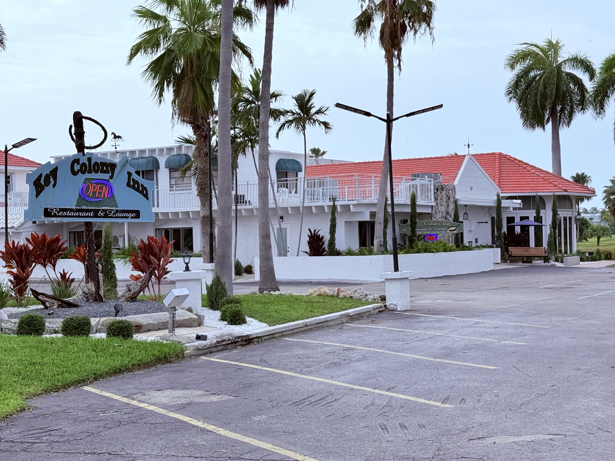 Colony Inn exterior with palm trees